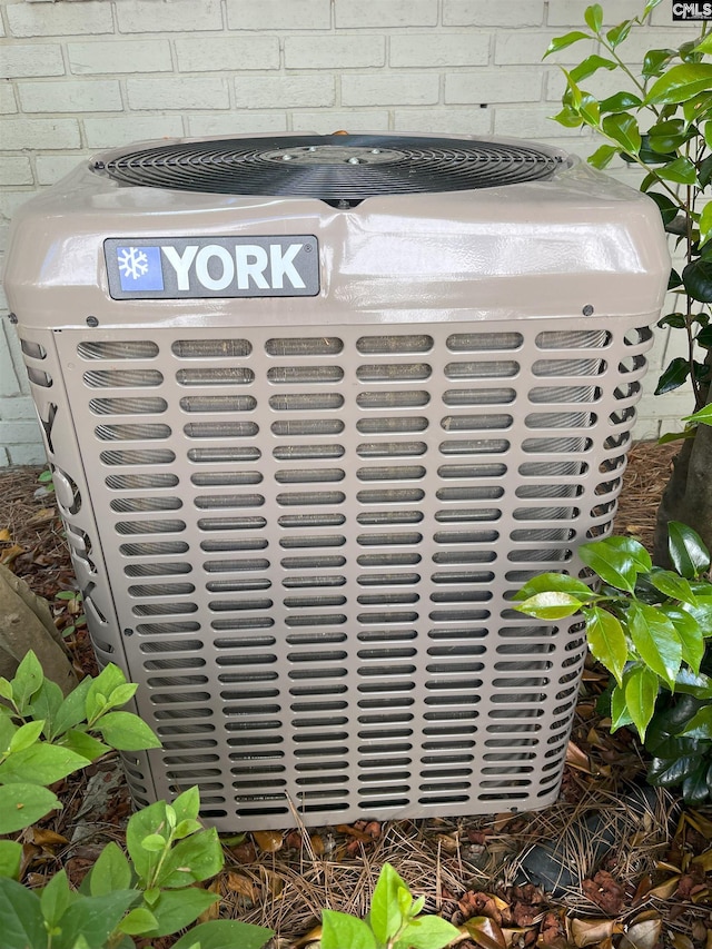 exterior details with central air condition unit and concrete block siding