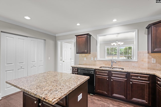 kitchen featuring dark brown cabinetry, a notable chandelier, a sink, black dishwasher, and decorative backsplash