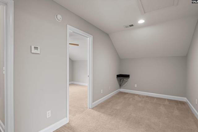 bonus room with visible vents, baseboards, vaulted ceiling, and light carpet