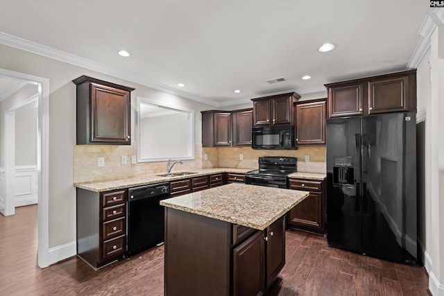 kitchen featuring visible vents, dark wood finished floors, dark brown cabinets, a sink, and black appliances