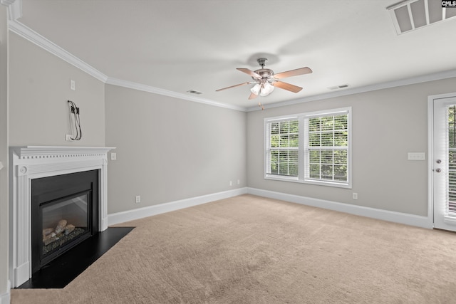 unfurnished living room with visible vents, ornamental molding, carpet, and baseboards