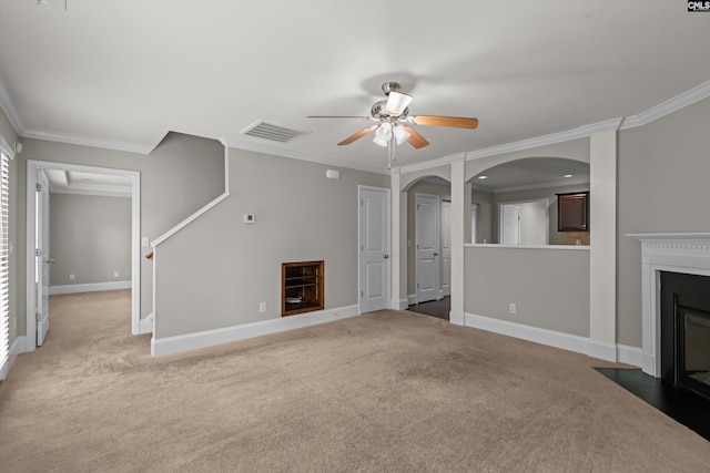 unfurnished living room with light carpet, a ceiling fan, a fireplace with flush hearth, visible vents, and ornamental molding