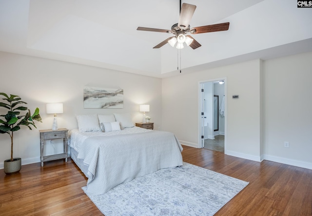 bedroom with baseboards, a ceiling fan, and wood finished floors