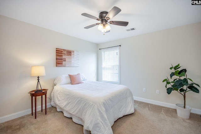 bedroom with baseboards, ceiling fan, light carpet, and visible vents