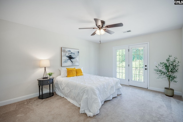 bedroom with carpet flooring, access to outside, baseboards, and visible vents