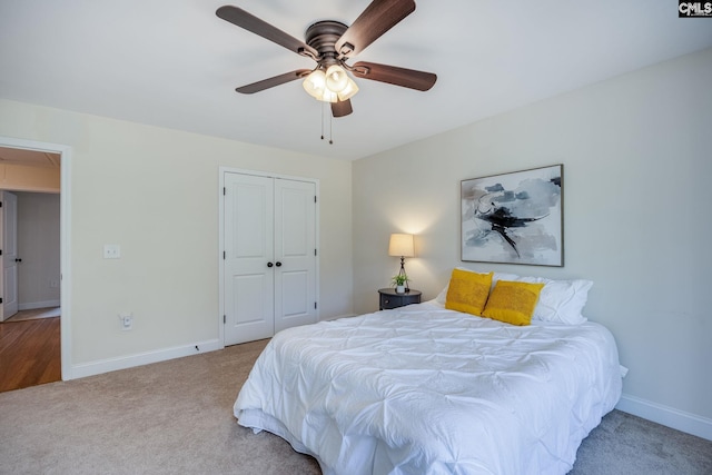 bedroom featuring a closet, carpet floors, baseboards, and attic access