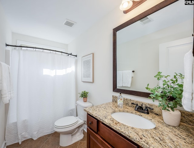 full bathroom with toilet, tile patterned floors, visible vents, and vanity