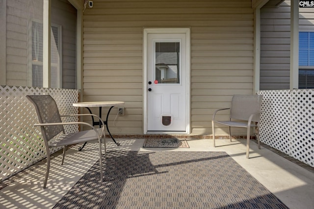 property entrance with a patio
