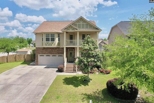 craftsman inspired home featuring concrete driveway, fence, a front yard, and a garage