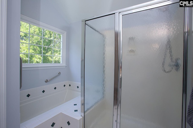 full bathroom with a garden tub, lofted ceiling, and a stall shower