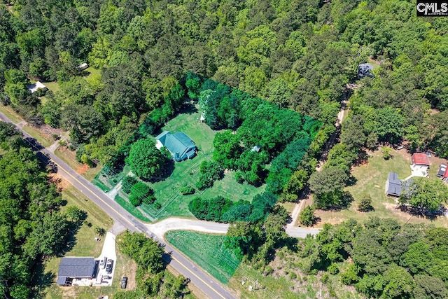aerial view featuring a wooded view