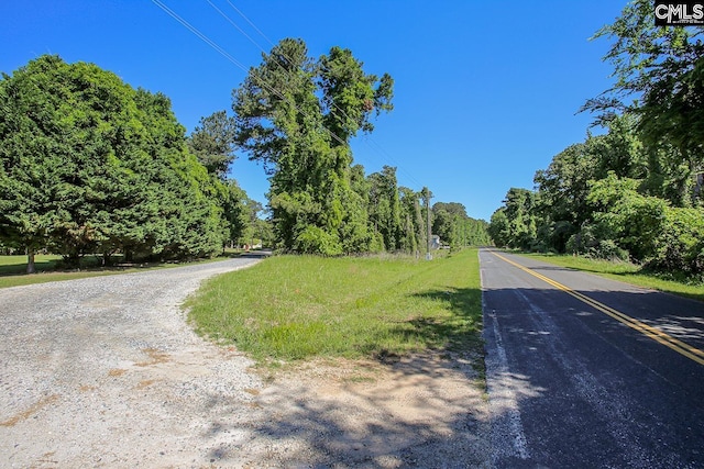 view of street featuring a wooded view