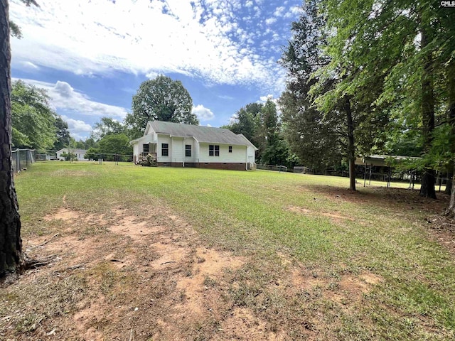 view of front of house with fence, a front yard, and crawl space