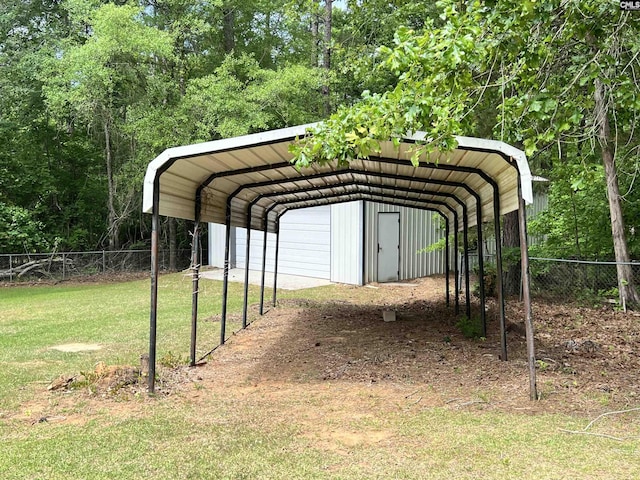 view of parking / parking lot with a detached carport and fence