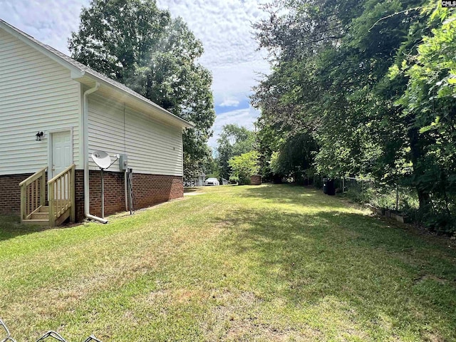 view of yard with entry steps