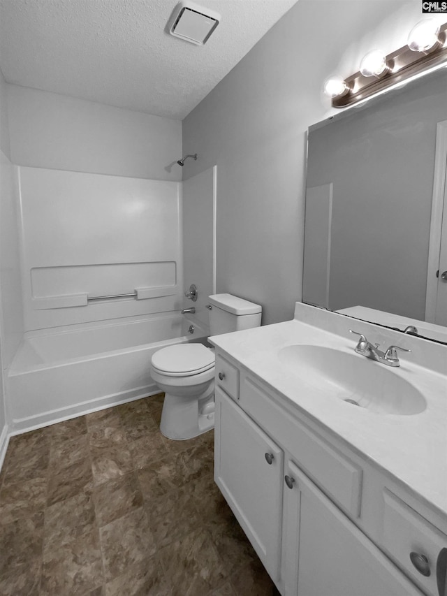 full bathroom with a textured ceiling, visible vents, vanity, toilet, and  shower combination