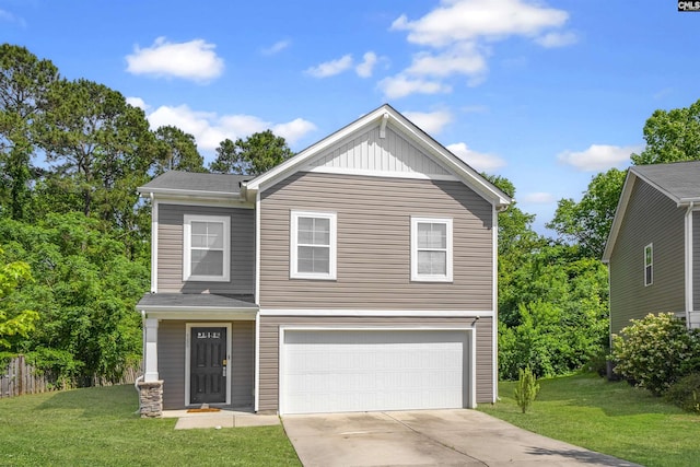view of front of property with an attached garage, a front lawn, and driveway