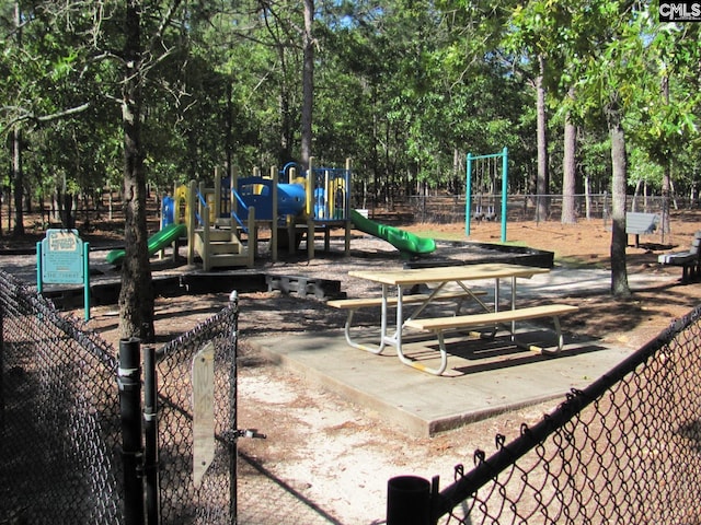15 Mapleleaf Dr, Columbia, SC 29229 - communal playground featuring fence and view of wooded area