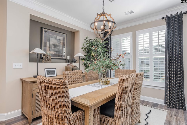 dining room featuring visible vents, baseboards, plenty of natural light, and a chandelier
