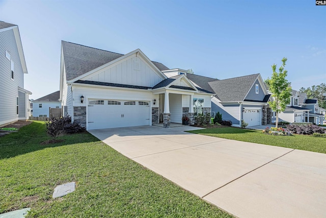 craftsman-style home featuring board and batten siding, driveway, a front lawn, an attached garage, and a shingled roof