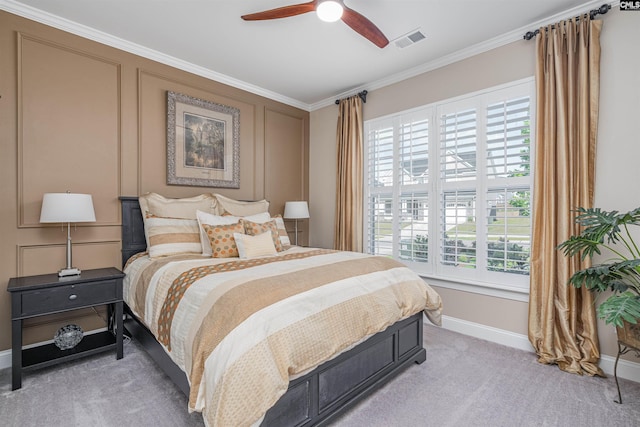 bedroom with light colored carpet, visible vents, multiple windows, and ornamental molding
