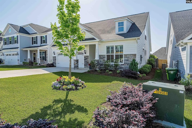 view of front facade featuring a garage, driveway, stone siding, and a front lawn