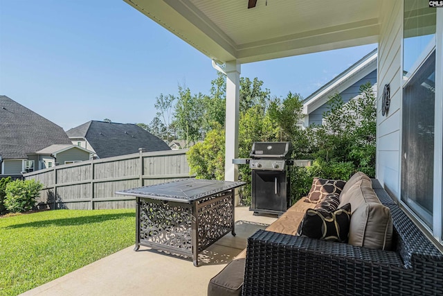 view of patio with fence, a ceiling fan, and a grill