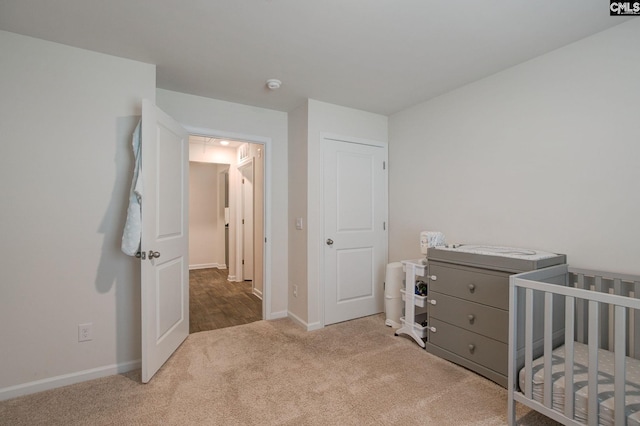 carpeted bedroom with baseboards