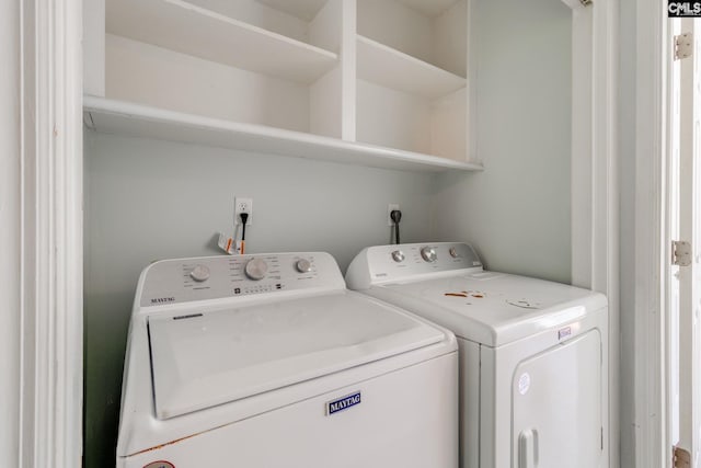 washroom with laundry area and washer and dryer