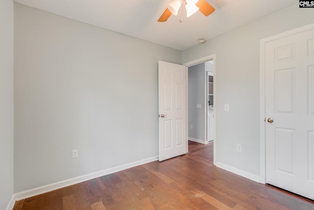 unfurnished bedroom with baseboards, a ceiling fan, and wood finished floors