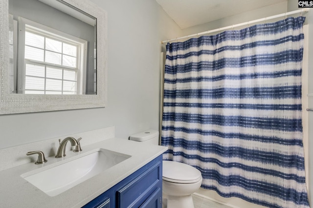 bathroom with toilet, curtained shower, and vanity