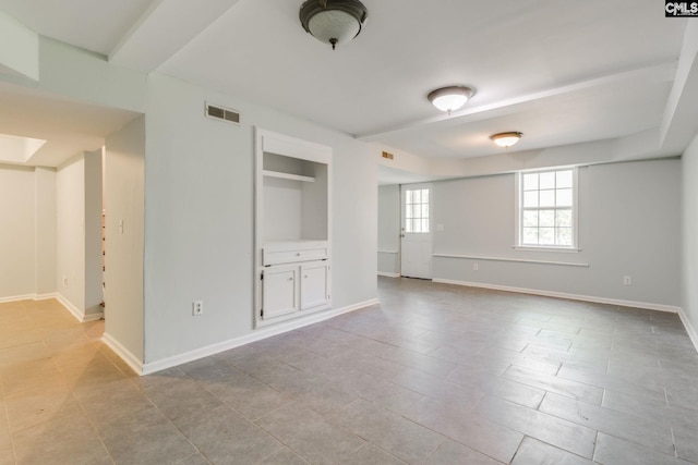 unfurnished bedroom featuring visible vents, baseboards, and tile patterned floors