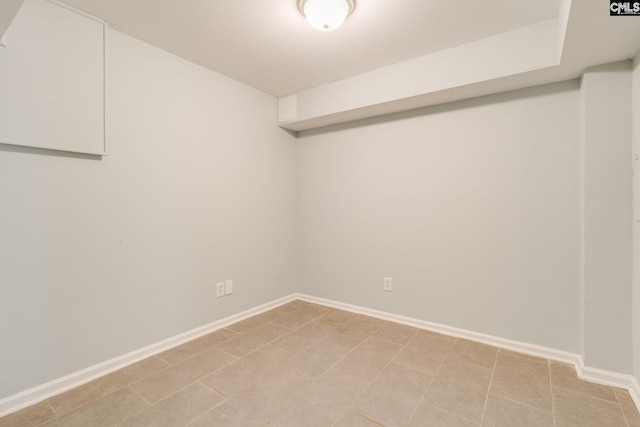 spare room with baseboards