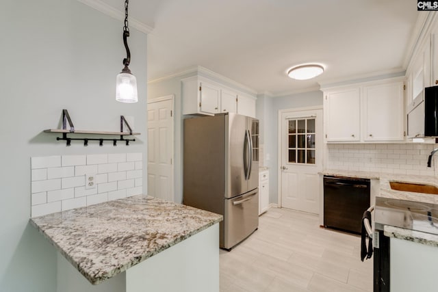 kitchen with freestanding refrigerator, decorative backsplash, ornamental molding, black dishwasher, and a sink
