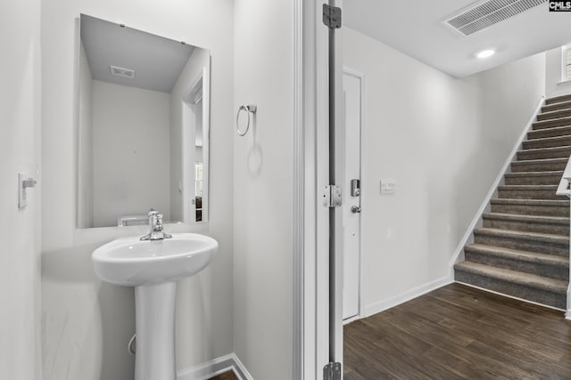 304 Sandbach Rd, Columbia, SC 29209 - bathroom with baseboards, a sink, visible vents, and wood finished floors