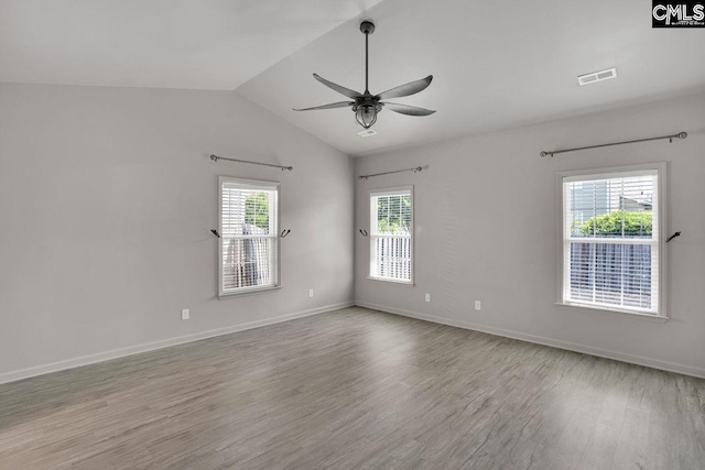 208 Wild Spring Ct, Lexington, SC 29072 - spare room with ceiling fan, baseboards, wood finished floors, vaulted ceiling, and visible vents