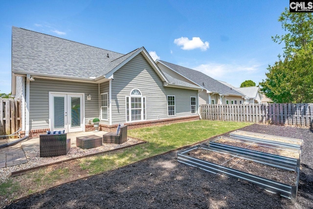 208 Wild Spring Ct, Lexington, SC 29072 - back of house with french doors, roof with shingles, a vegetable garden, fence, and a patio