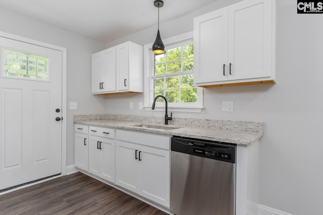 kitchen featuring baseboards, a sink, white cabinetry, and dishwasher