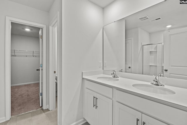 105 Maple Ct, Lugoff, SC 29073 - bathroom featuring baseboards, a sink, double vanity, and visible vents