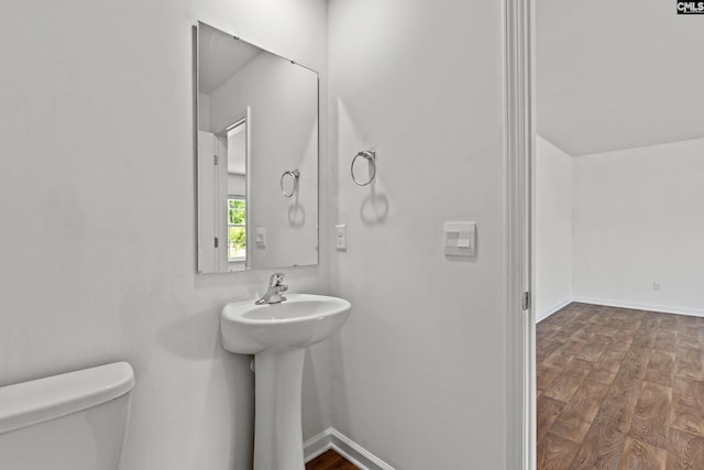 105 Maple Ct, Lugoff, SC 29073 - half bathroom featuring a sink, baseboards, toilet, and wood finished floors