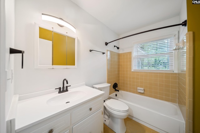bathroom featuring vanity, washtub / shower combination, and toilet