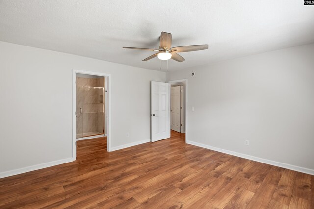 unfurnished bedroom with baseboards, ceiling fan, and wood finished floors