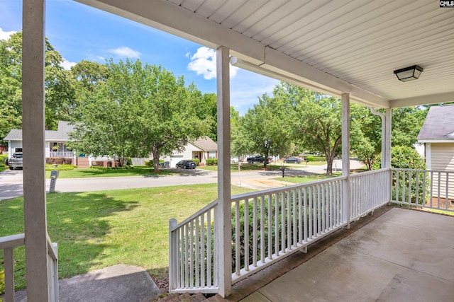 view of patio featuring a porch and a residential view