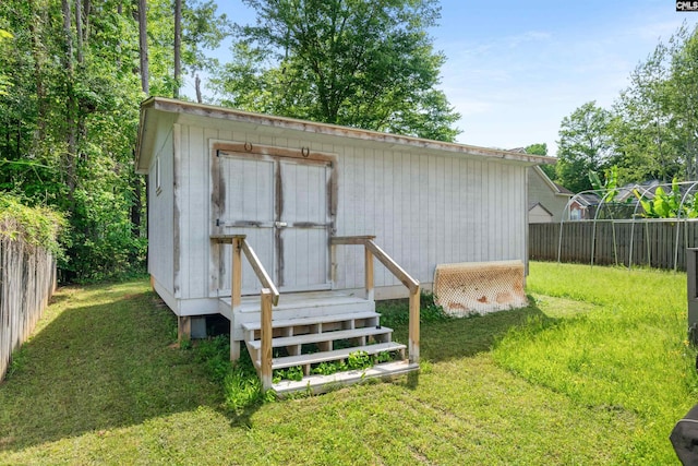 view of shed with fence