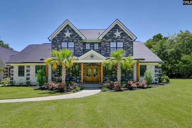 craftsman inspired home with a porch, a front lawn, and stone siding