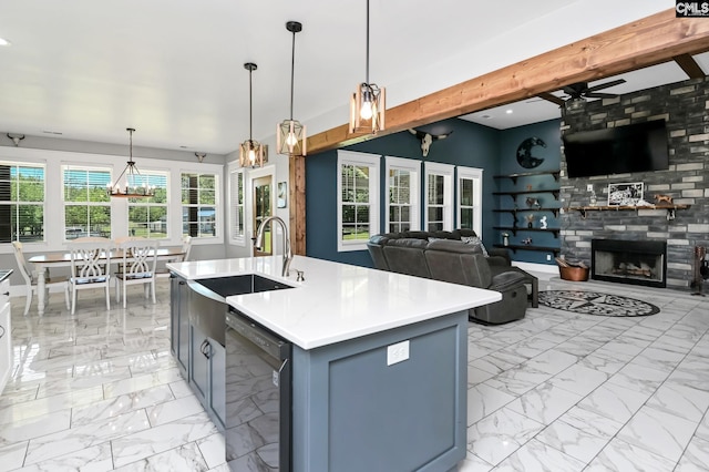 kitchen with black dishwasher, open floor plan, a sink, and marble finish floor