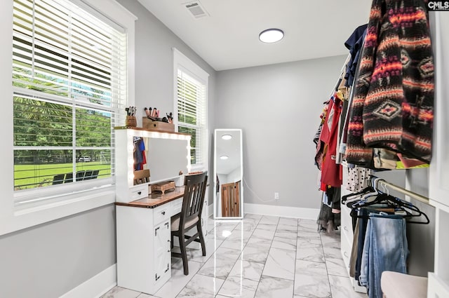 office featuring baseboards, visible vents, and marble finish floor