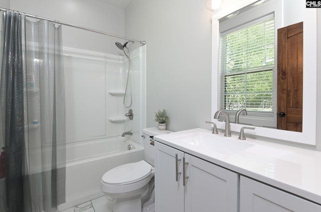 bathroom featuring vanity, marble finish floor, shower / bath combo with shower curtain, and toilet