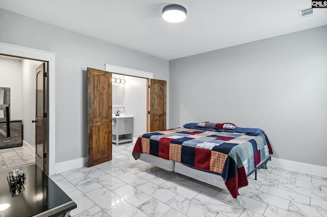 bedroom featuring connected bathroom, baseboards, visible vents, and marble finish floor
