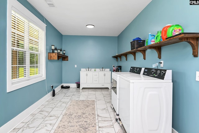 laundry room featuring laundry area, visible vents, washing machine and clothes dryer, baseboards, and marble finish floor